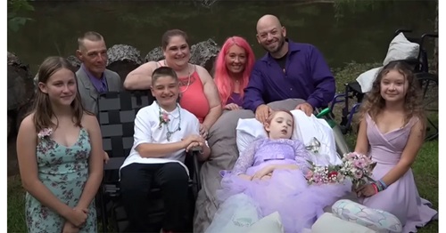 Courageous young girl wheeled down the aisle by her father to wed her school sweetheart shortly before passing.